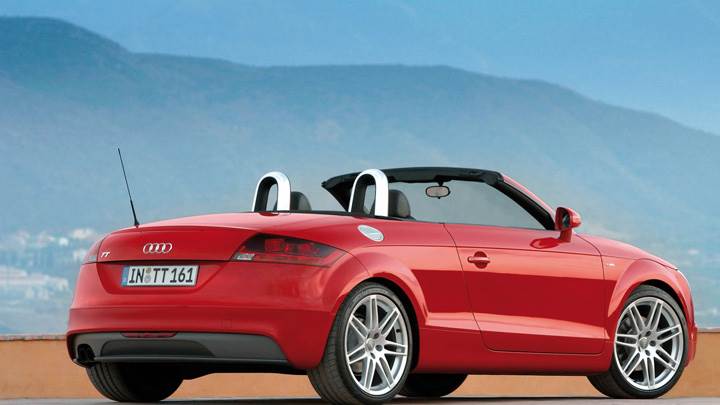 Side Back Pose Of Audi TT Roadster In Red Near Mountains